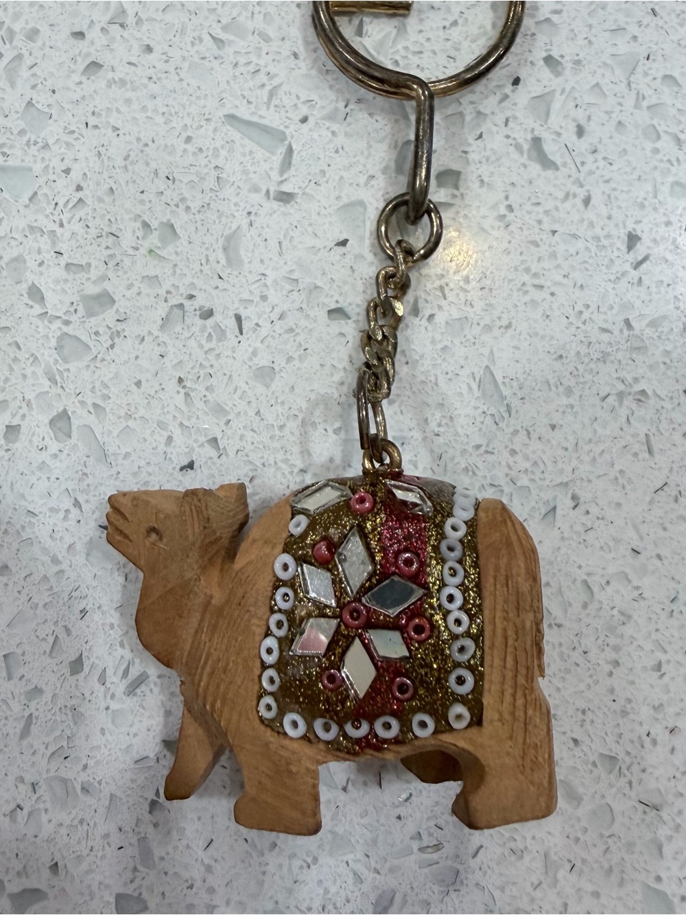 Handcrafted Wooden Camel Keyring with Red and Gold Embellished Saddle